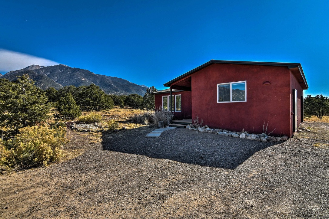 Cabin exterior with Sangre de Cristo mountains