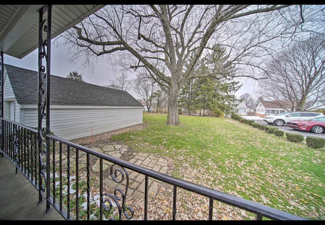 Covered porch overlooking the yard